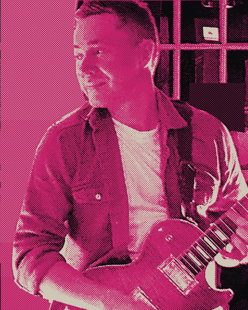 Matt playing a single-cut electric guitar